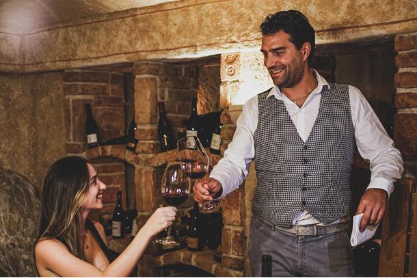 Two people in the wine cellar